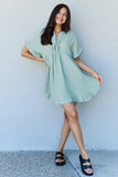 Out Of Time Ruffle Hem Dress with Drawstring Waistband in Light Sage
